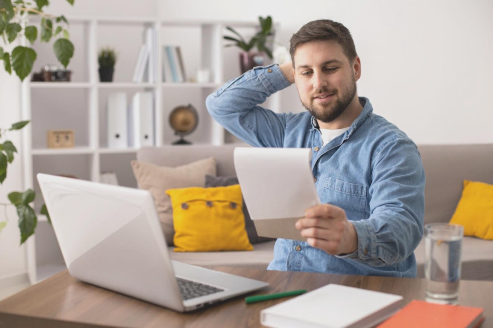 Family reviewing financial documents together at kitchen table
