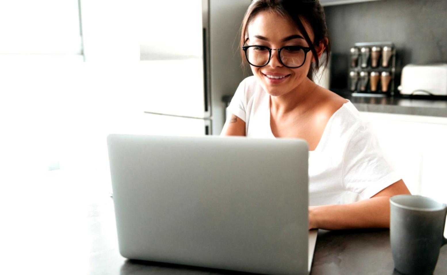 Family reviewing financial documents together at kitchen table